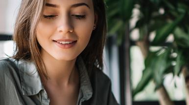 Consultant accessing cybersecurity training via laptop at home