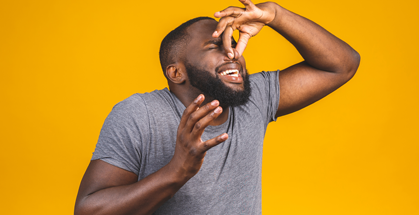 Man holding his nose because he smells something stinky